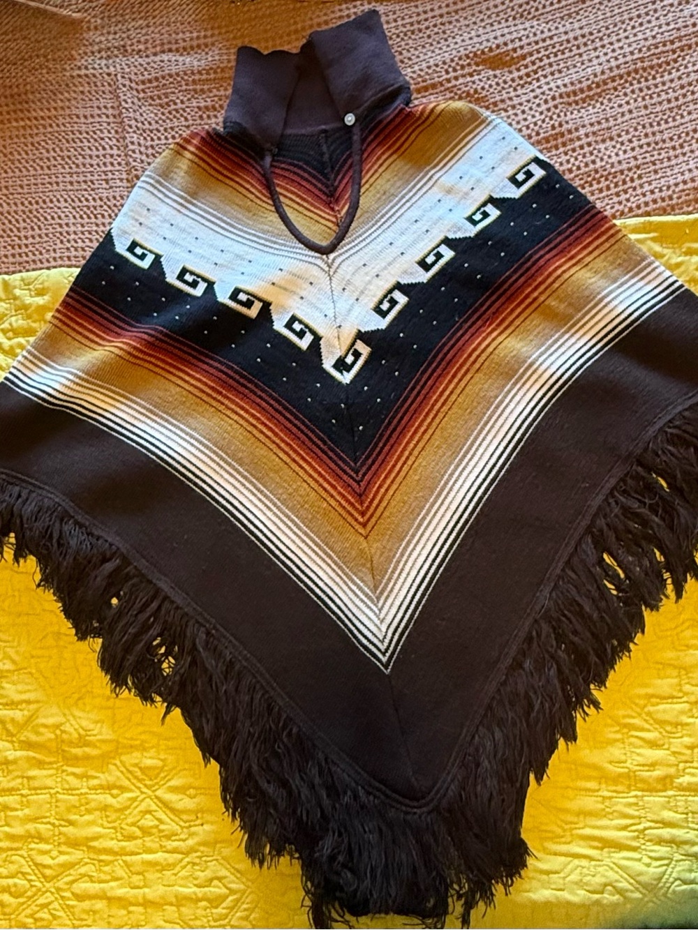 Woven Fringe Poncho in Black with Sunset Stripes